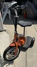 Ewheels 3-WHEEL Mobility Scooter W/ Seat & Basket, Orange/black. Fixed Price $250.00.