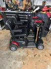 Golden Buzzaround Ex 4-WHEELED Scooter Black/red Padded Armrest. Fixed Price $699.00.
