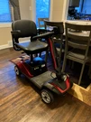 Brand New Sacvon 4WHEEL Mobility Scooter, Foldable, Two Baskets, Headlights, Red. Fixed Price $570.00.