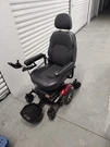 Merits Power Wheelchair Joystick Flip Up Armrests Black Seat Red Fenders. Fixed Price $200.00.