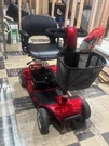 Equate Mobility 4-WHEEL Motorized Power Scooter, Red. Fixed Price $450.00.