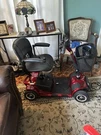 Red Vive 4 Wheel Mobility Scooter 265 Lb Cap Basket Headlight Swivel Seat. Fixed Price $575.00.