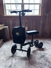 Helavo Knee Walker, 4-WHEEL, Handbrakes, Adjustable, Foldable, Storage, Black. Fixed Price $80.00.
